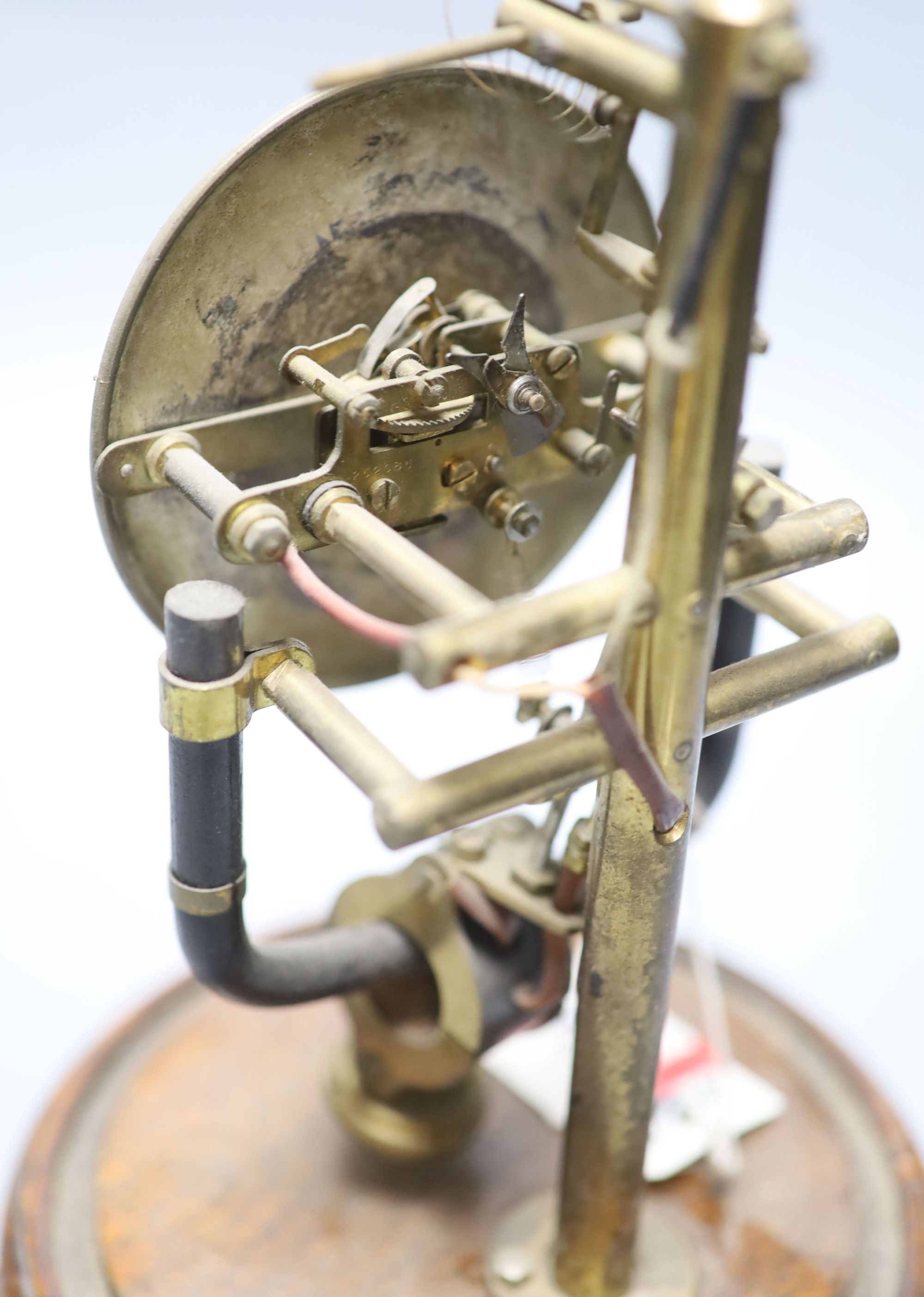 A Bulle type electric mantel timepiece under a dome, overall height 25cm